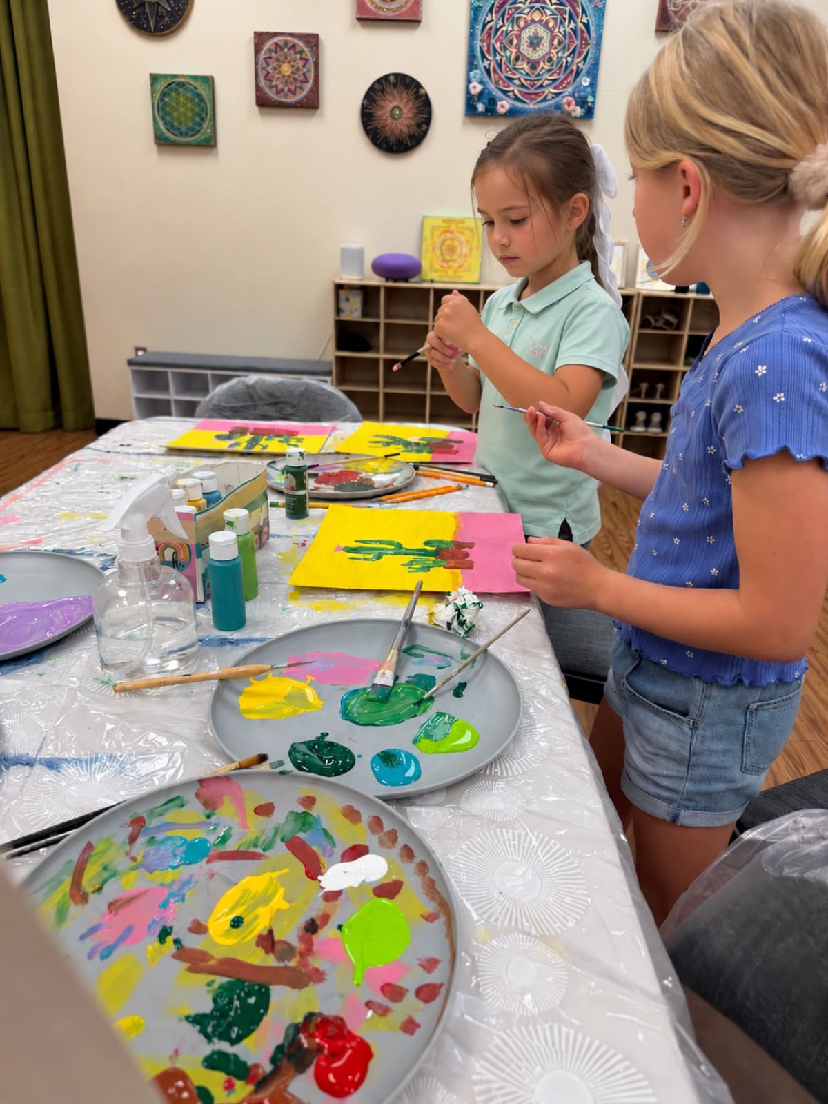 Young artists painting together in the studio